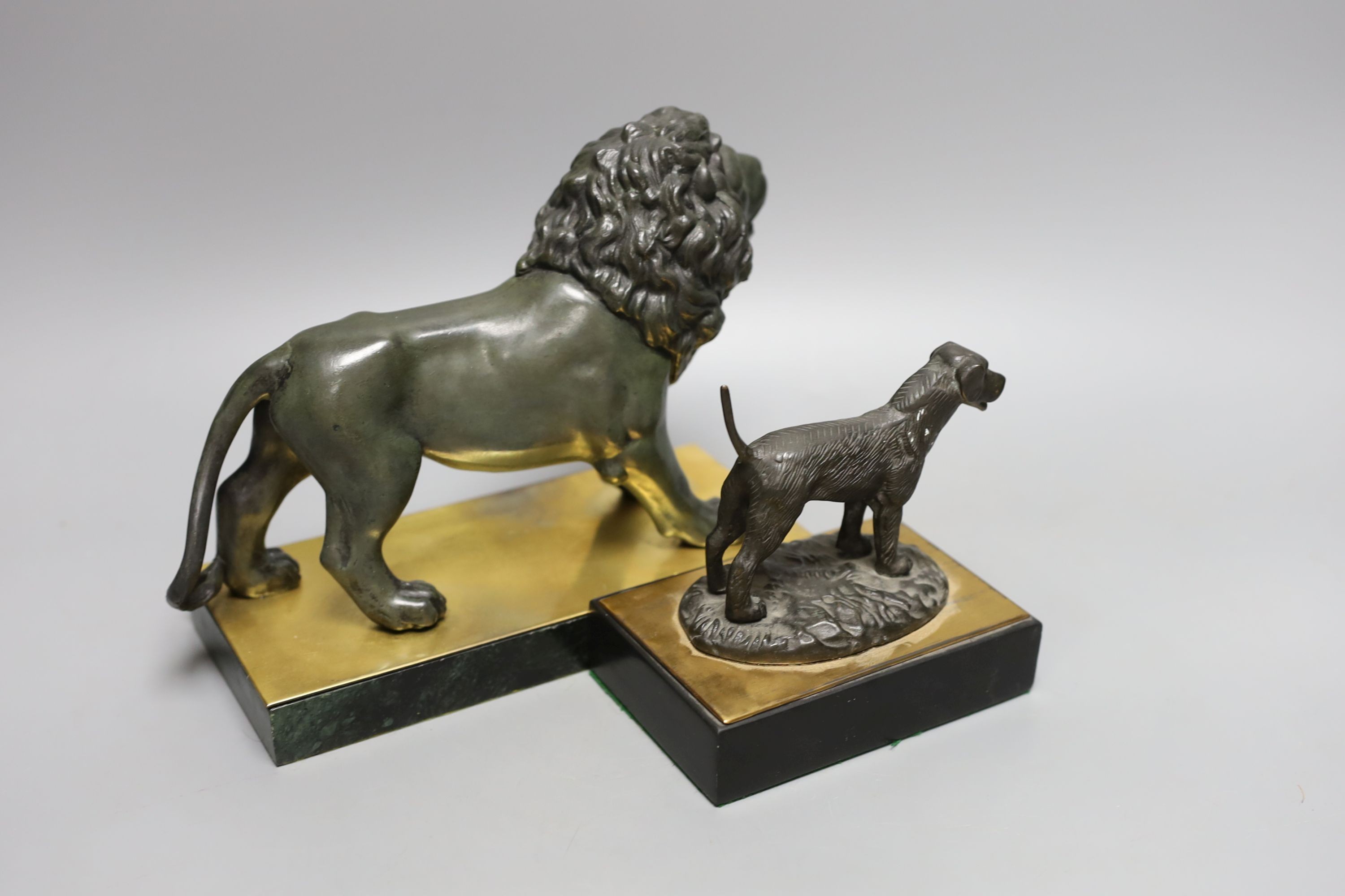 A bronze of a lion on marble base together with a bronze of a sporting dog. Longest 23cm